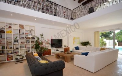 #114 Riviera Maya single family home with vaulted ceiling over the living room area with built-in cabinetry