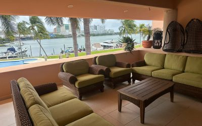 #23 Isla Dorada, Cancun - Luxury Furnished house covered patio area overlooking pool and lagoon