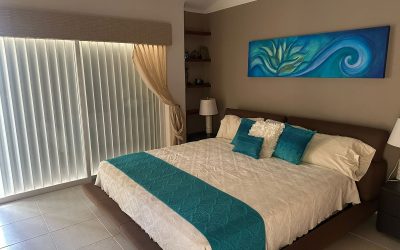 #23 Isla Dorada, Cancun - Luxury Furnished house with bedroom furnished with king size bed and sliding glass doors.