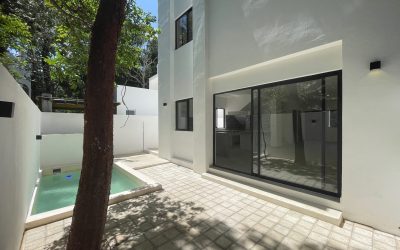 #40 Puerto Morelos - Aldea Umm exterior view of the patio and sliding glass doors on the rear of the house