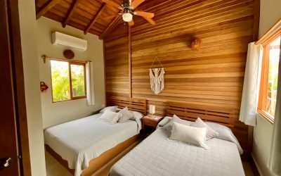 Botique Hotel Holbox cozy bedroom with air conditioning and ceiling fan